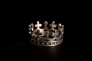 crown shaped ring made of solid sterling silver with cross on it. jewelry for brutal men on black...