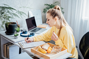 Flexible working, flexible work. Young woman freelancer working at home office with laptop and...