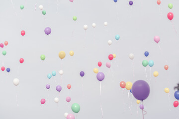 Lots of balloons flown through the sky with pastel shades