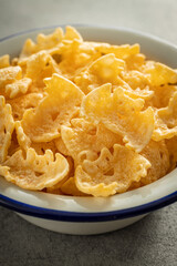 Halloween crispy bat shaped chips in bowl.