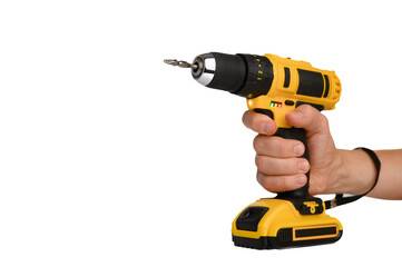 Cordless electric yellow screwdriver drill in hand isolated on white background. Close-up.