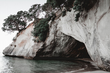 entrance of a cave in the rocks of the sea water