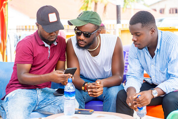 image of african men with smartphone- black guys enjoying social media