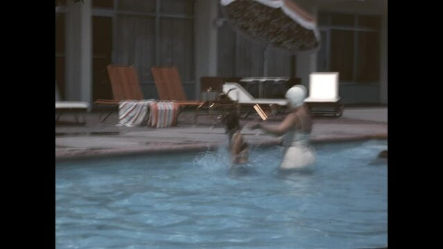 Family Pool Fun 1965 - A mother and her children enjoy the pool at a Miami, Florida hotel in 1965. 
