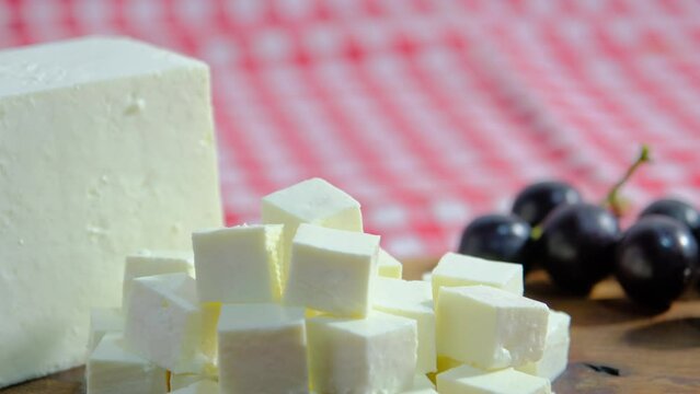 Cheese platter, Cubes of cheese, get cheese from plate. 4K UHD Video