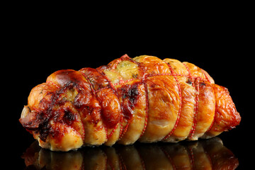 boneless meat roulade isolated on a black background
