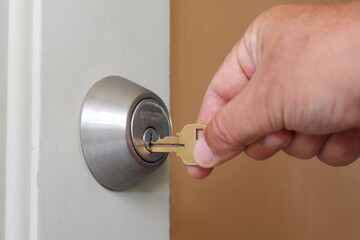 A key inserted into a lock which has no handle