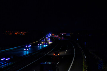 Fototapeta na wymiar Speed Traffic - Highway at Night - Cars - Nachtverkehr auf Autobahn - Light Trails - Datenautobahn - Speeding - German - Ecology - Long Exposure - High quality photo