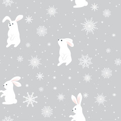 A white rabbit with snowflakes on a gray background. The symbol of the Chinese New Year. Wrapping paper, winter greetings, web page background, Christmas and New Year greeting cards