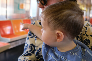 little toddler with mom on nyc subway