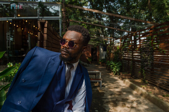 black man in suit posing 