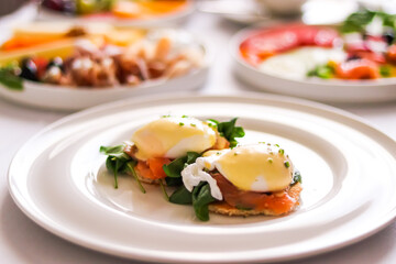 Luxury breakfast, brunch and food recipe, poached eggs with salmon and greens on gluten-free toast...