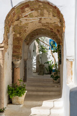 Quiet street with white houses and blue doors ands windows in Sidi Bou Said village near Carthage and Tunis, Tunisia
