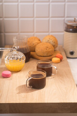 Americano in glass cups stands being poured from Turks