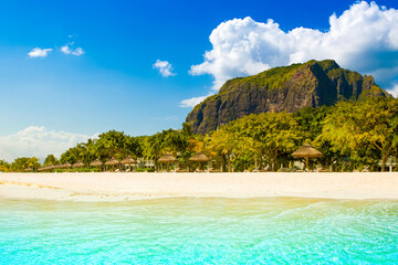 Tropical beach on the shore of Indian Ocean near Le Morne Brabant mountain, Mauritius