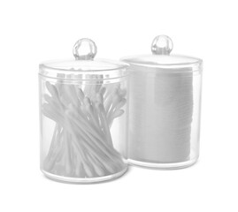 Cotton pads and swabs in plastic jars on white background