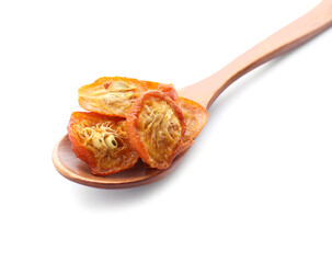 Wooden spoon with cut dried kumquat fruits isolated on white