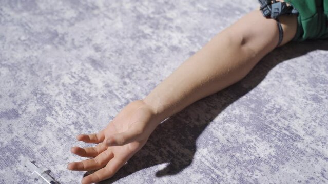 The man taking a high dose of heroin from a syringe.
Drug addicted man is unconscious from overdose.
