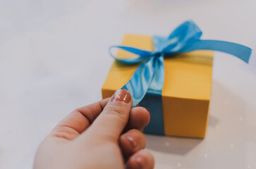 hand holding box gift