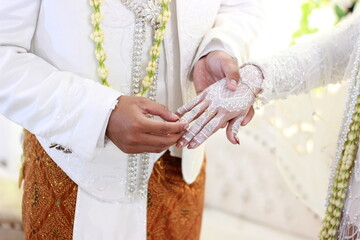 close up of a couple holding hands