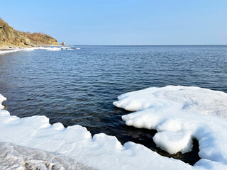 The ice-covered coastal strip of one of the bays of the Ussuri Bay, Russia, Vladivostok
