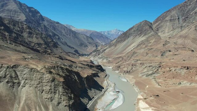 Aerial view of Sangam &ndash; the confluence of the Indus river (green colour) and the Zanskar river (blue or brown colour depending on the season) in Ladakh, India. 