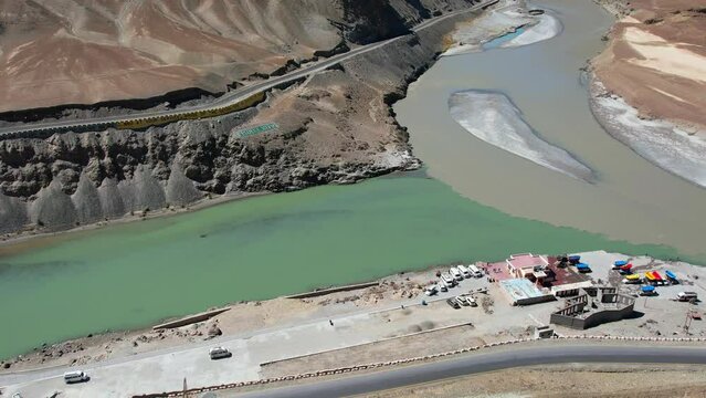 Aerial view of Sangam &ndash; the confluence of the Indus river (green colour) and the Zanskar river (blue or brown colour depending on the season) in Ladakh, India. 