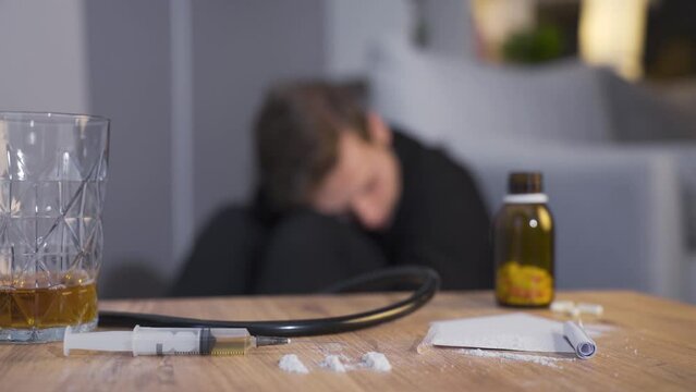 The person who has taken drugs is experiencing hallucinations and drug-related experiences.
Problem man addicted to drugs and alcohol is hallucinating and having a seizure.
