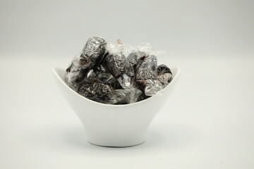 Fruit snacks are black pellets wrapped in plastic.