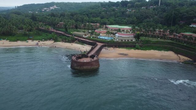 Goa, India 19th October 2022: 4k Drone shots Fort Aguada in North Goa - Seventeenth-century Portuguese fort standing on Sinquerim Beach. Popular also Watersports activities and white sand beach.  