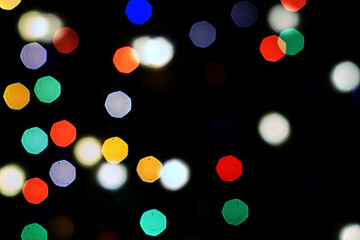 multicolored festive lights on a black background screensaver backdrop