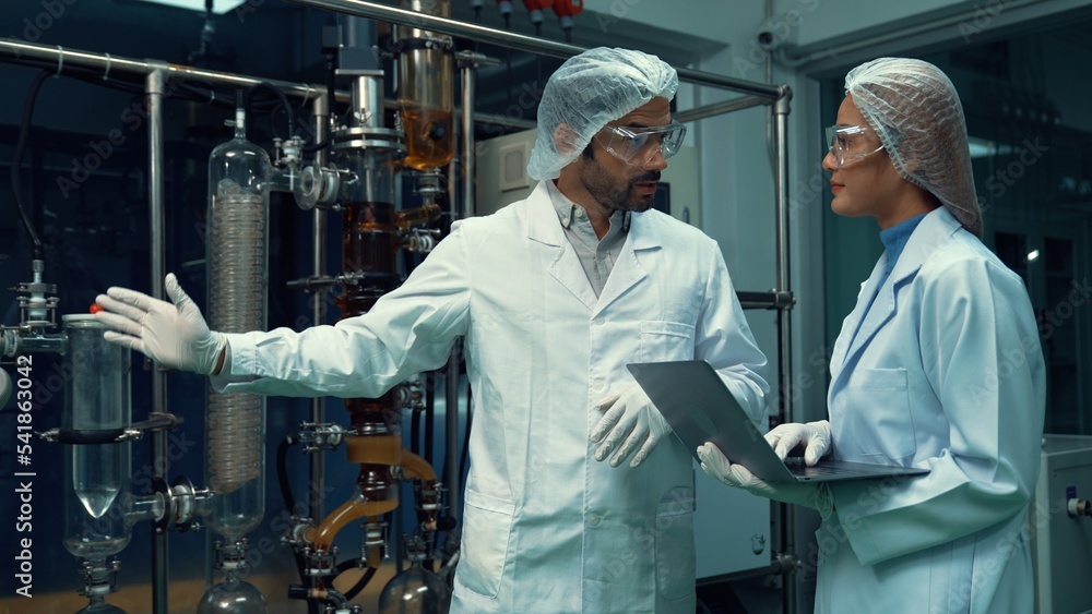 Poster two scientist in professional uniform working in laboratory for chemical and biomedical experiment