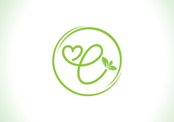 Love healthy and green nutrition leaf logo design with the letters. Green love leaf logo