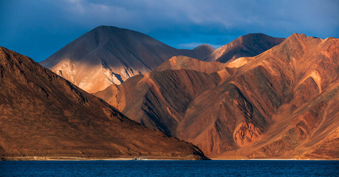 Pangong Lake world’s highest saltwater lake dyed in blue stand in stark contrast to the arid mountains surrounding it