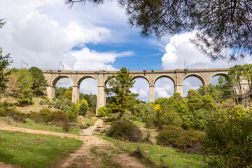 Fototapeta premium railway bridge that crosses the cofio river in the Sierra de Guadarrama, Madrid