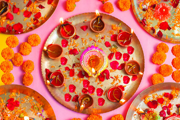 Happy Diwali candle lit with decorative background. 