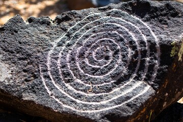 Close up of a rock with a spiral circle petroglyph in the Petroglyph National Monument