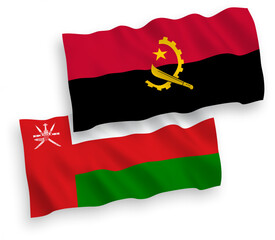 National vector fabric wave flags of Sultanate of Oman and Angola isolated on white background. 1 to 2 proportion.