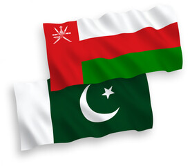 National vector fabric wave flags of Sultanate of Oman and Pakistan isolated on white background. 1 to 2 proportion.