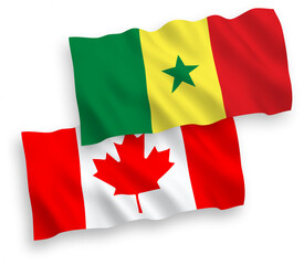 National vector fabric wave flags of Canada and Republic of Senegal isolated on white background. 1 to 2 proportion.