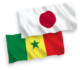 National vector fabric wave flags of Japan and Republic of Senegal isolated on white background. 1 to 2 proportion.