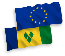 National vector fabric wave flags of European Union and Saint Vincent and the Grenadines isolated on white background. 1 to 2 proportion.