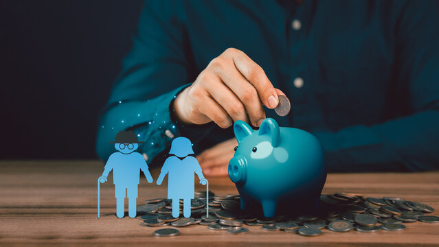 Man putting coin into piggy bank for saving money, retirement, health care, business finance and investment.