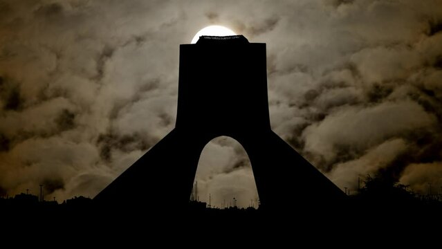 Azadi Tower By Night with Dark Atmosphere, Fog, Smoke, and Full Moon, Tehran, Iran