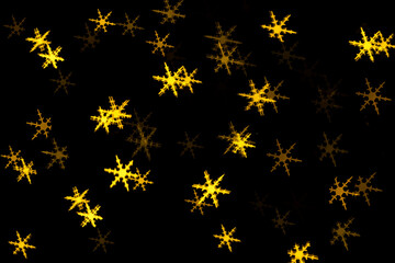 Gold abstract christmas bokeh on black background
