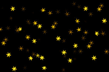 Golden holiday glowing backdrop. Defocused bokeh background