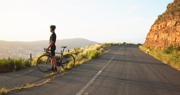 Man, bicycle and fitness, celebrate on the road, cyclist excited and winner with arms raised, success while training outdoor. Bike, cycling and exercise, athlete at sunrise, healthy and active life.