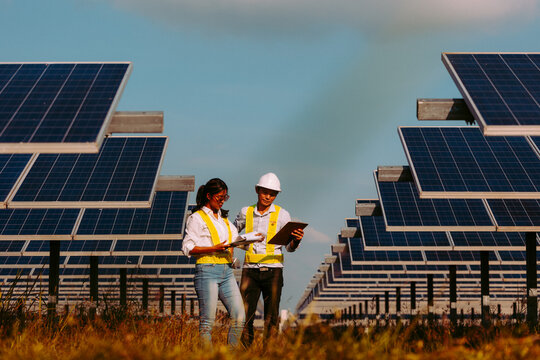 Inspector engineering concept; Engineer inspect solar panel  at solar power plant .