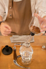 Syphon coffee maker in craft cafe
