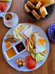 Amazing Turkish breakfast. Beautiful appetites food background, decorated cheese, bread, fried potatoes and vegetables. Traditional table.

